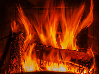 Image showing fireplace with wood and fire