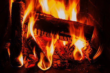 Image showing fireplace with wood and fire