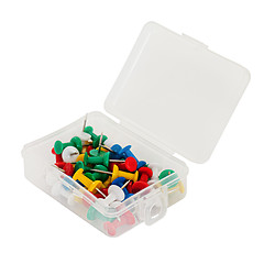 Image showing transparent plastic box with thumbtacks isolated on white backgr