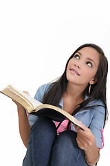 Image showing Beautiful young woman holding a Bible