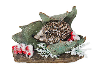 Image showing Christmas composition of hedgehog, mountain ash, stone and leaf 