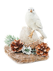 Image showing Christmas arrangement of bird on a nut with cones, pine needles 