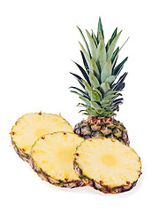 Image showing ripe pineapple with slices isolated on white background