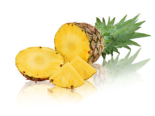 Image showing ripe pineapple with slices isolated on white background