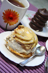 Image showing Tea and glazed sweets 