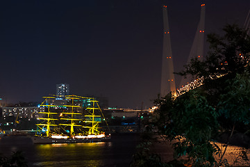 Image showing night view on the sailboat Pallada near the bridge in the Russia