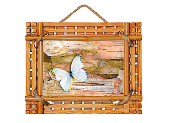 Image showing  bamboo photo frame with abstract composition of butterflies, bi