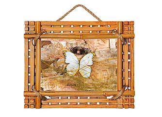 Image showing bamboo photo frame with abstract composition of butterflies, bir