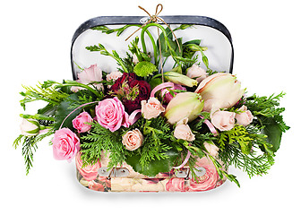 Image showing a colorful floral arrangement of roses and lilies in acardboard 