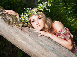 Image showing Beautiful girl in the national dress and and a wreath stand in t