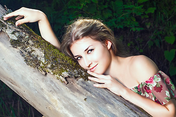 Image showing Beautiful girl in the national dress stand in the  forest