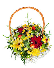 Image showing colorful flower bouquet arrangement centerpiece in a wicker gift