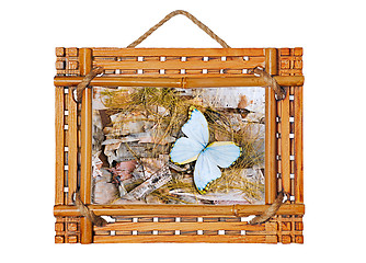 Image showing bamboo photo frame with abstract composition of butterflies, bir