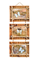 Image showing three bamboo photo frames with abstract composition of butterfli