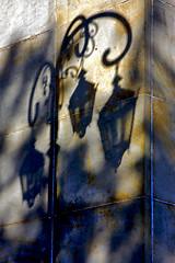 Image showing shadow of a street lamp and a yellow orange marble