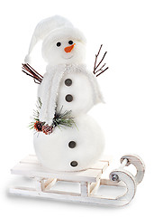 Image showing snowman on sled isolated on white background 