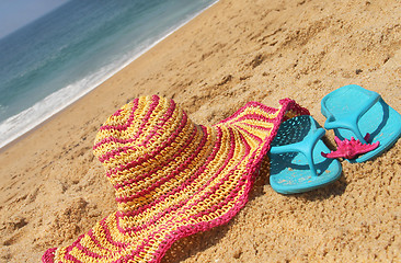 Image showing Seacoast and straw pink hat 