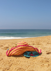 Image showing Seacoast and straw pink hat 