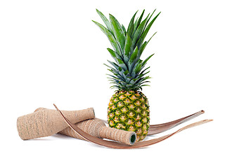 Image showing still life of pineapple and decorated bottles isolated on white 