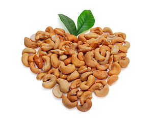 Image showing Cashew nuts in the form of heart with leaves isolated on white b