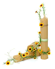 Image showing Uncooked Italian spaghetti decorated with yellow flowers isolate