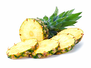 Image showing ripe pineapple with slices  isolated on white background