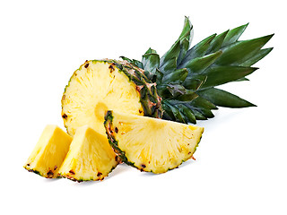 Image showing ripe pineapple with slices  isolated on white background