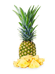 Image showing ripe pineapple with slices  isolated on white background