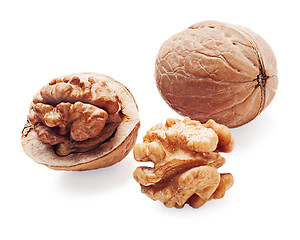 Image showing walnut and a cracked walnuts  isolated on the white background