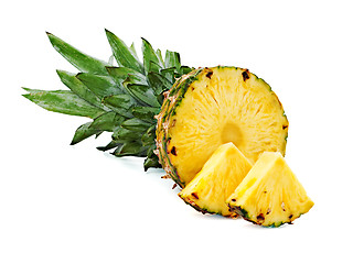 Image showing ripe pineapple with slices  isolated on white background