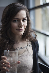 Image showing Young Woman Drinking a Pint Glass of Ice Water
