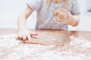 Image showing Young girl making gingerbread