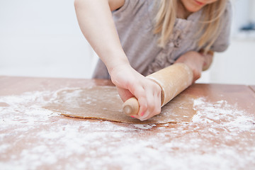 Image showing Young girl making gingerbread