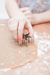 Image showing Cutting gingerbread shapes from dough