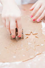 Image showing Cutting gingerbread shapes from dough