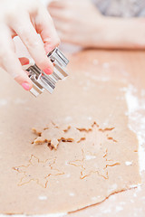 Image showing Cutting gingerbread shapes from dough