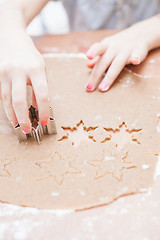 Image showing Cutting gingerbread shapes from dough