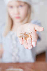 Image showing Young girl showing gingerbread shape