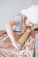 Image showing Young girl making gingerbread