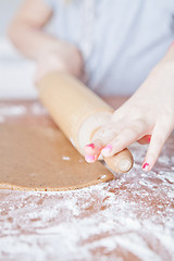 Image showing Young girl making gingerbread