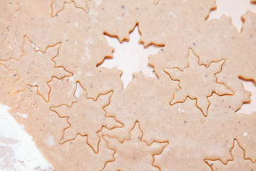 Image showing Gingerbread dough with star shapes