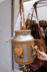 Image showing churn brown leather straps pockets long handle 