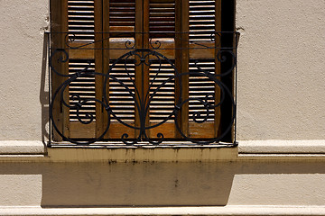 Image showing old window grate and shadow 