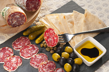 Image showing cold cut platter with pita bread and pickles