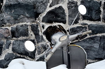 Image showing scooter covered with snow 