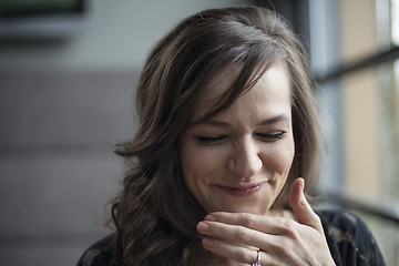 Image showing Portrait of Beautiful Young Woman with Brown Hair Laughing