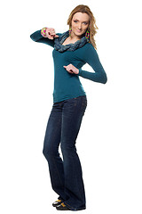 Image showing Young woman in a blue jeans