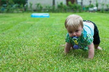 Image showing Baby boy crawling