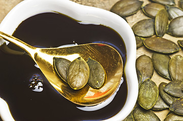Image showing pumpkin seed oil with seeds