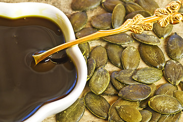 Image showing pumpkin seed oil with seeds